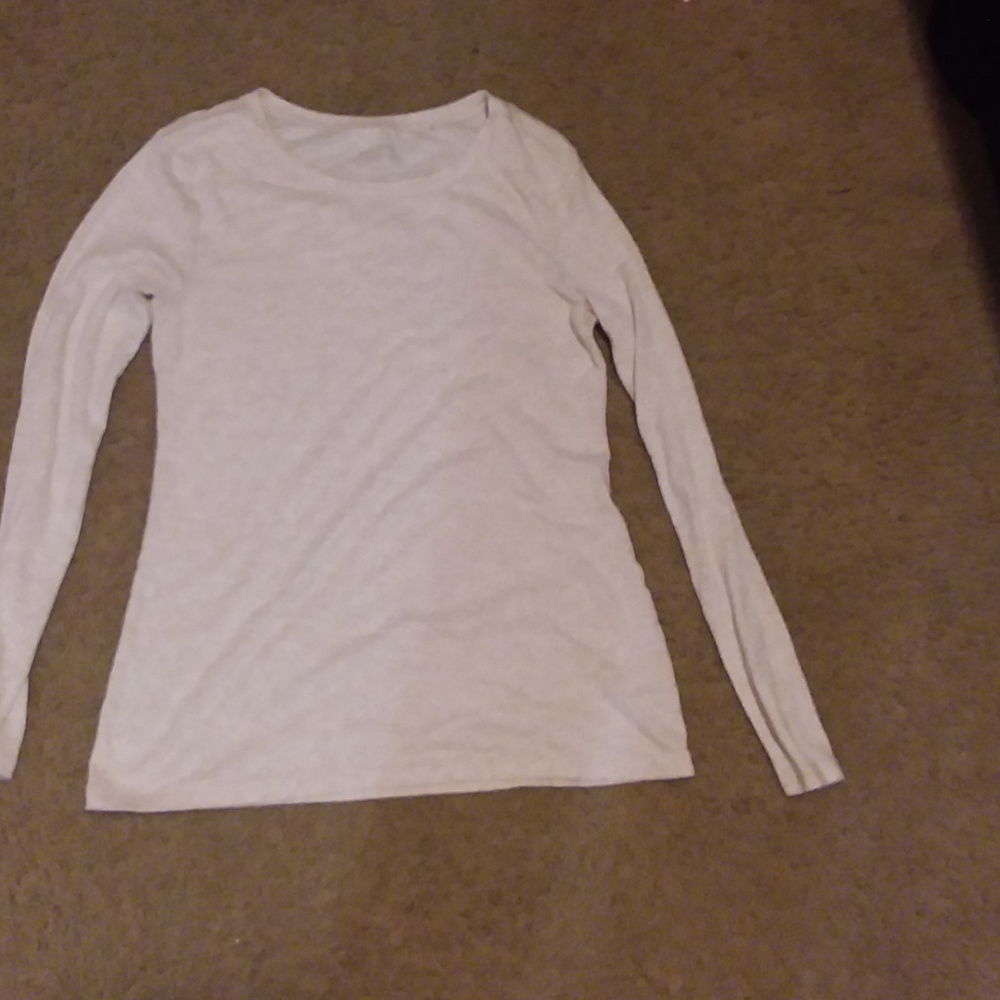 A beige shirt with long sleeves